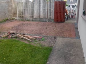 Granite Slabbed Patio with Charcoal Borderline and Connemara Walling in Killinierin, Co. Wexford