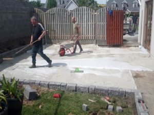 Granite Slabbed Patio with Charcoal Borderline and Connemara Walling in Killinierin, Co. Wexford