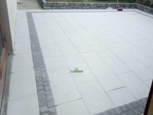 Granite Slabbed Patio with Charcoal Borderline and Connemara Walling in Killinierin, Co. Wexford