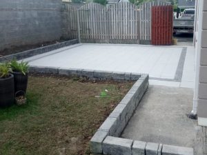 Granite Slabbed Patio with Charcoal Borderline and Connemara Walling in Killinierin, Co. Wexford