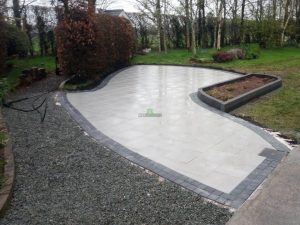 Patio with Silver Granite Slabs and Raised Flower-Bed in New Ross, Co. Wexford